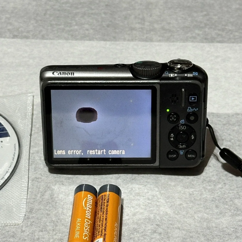 Canon PowerShot A2000 IS 10MP Digital Camera Pink For Parts Or Repair Lens Error